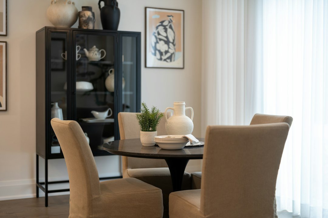 Warm neutral dining room with a styled sideboard and natural finishes