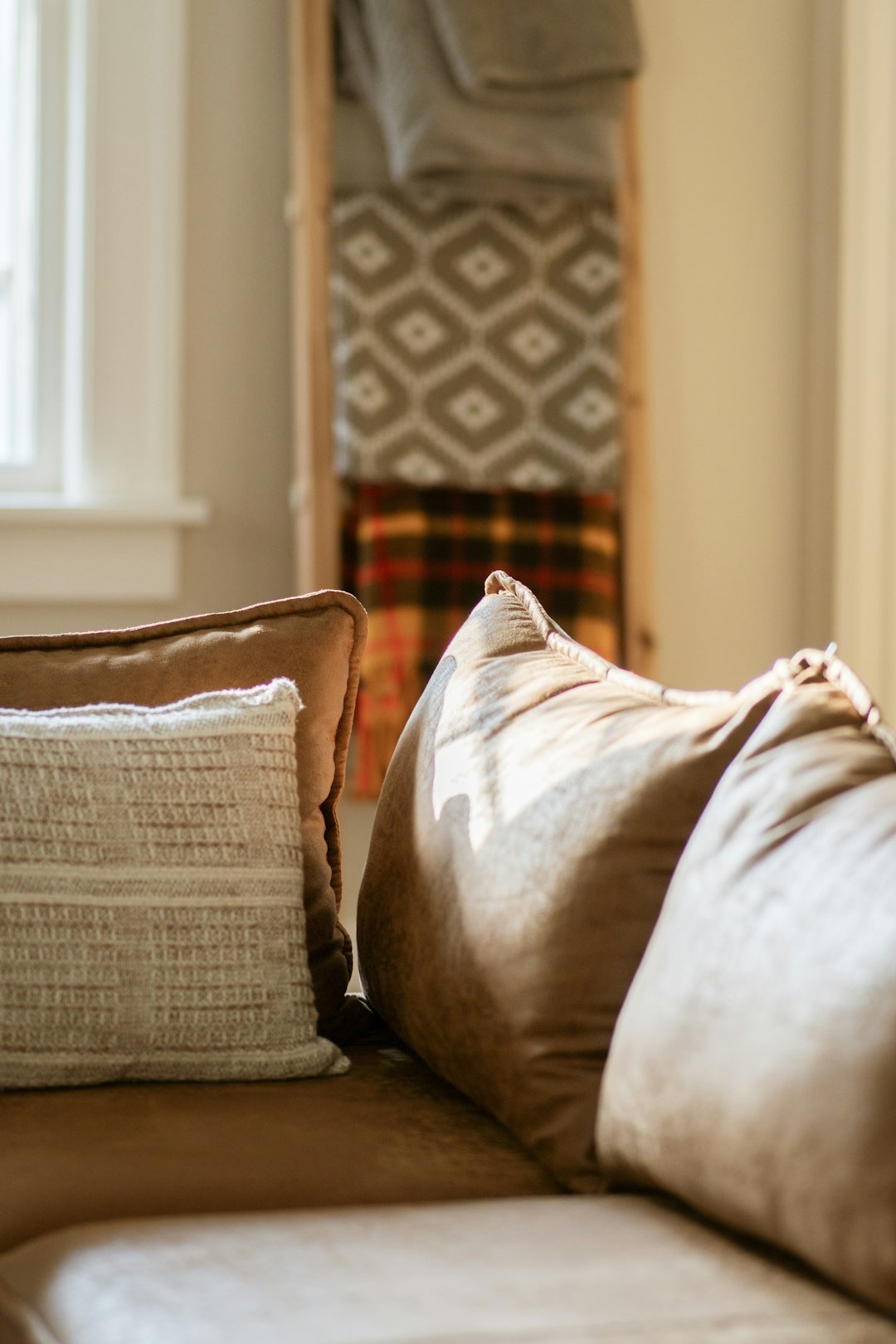 Neutral sofa with soft cushions illustrating removable sofa cover and upholstery care choices
