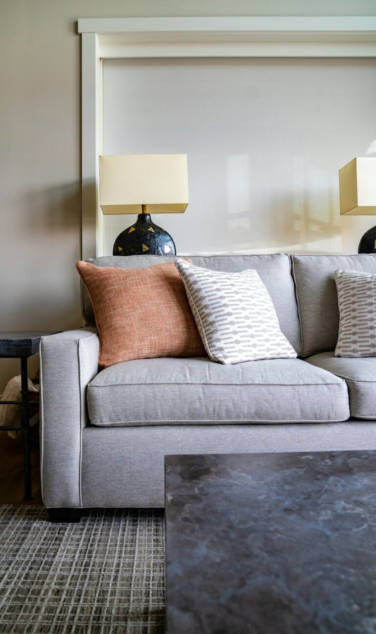 Neutral sofa with cushions illustrating foam, fibre and feather sofa filling choices