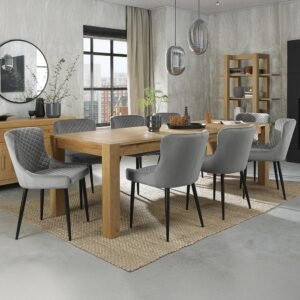 Bentley Turin light oak extending dining set with eight grey velvet chairs